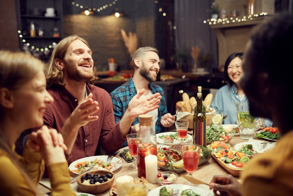 Friends enjoying a meal together around a table